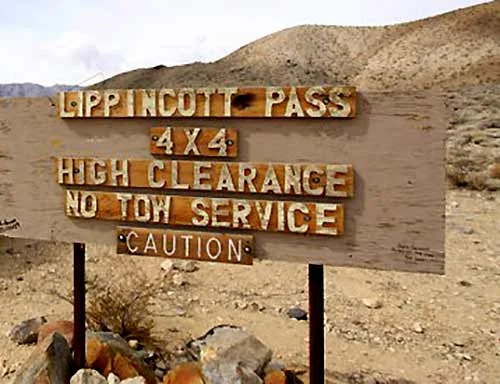 Lippincott Pass 4x4 high-clearance warning sign on a Death Valley off-road route