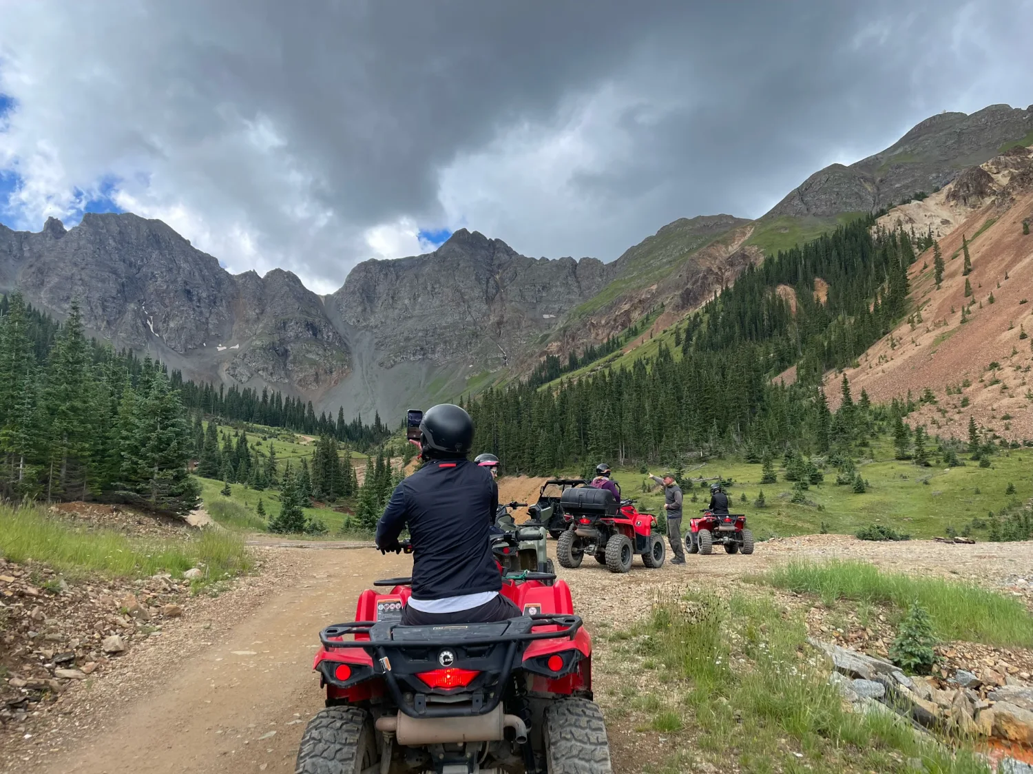 Executives riding the trail into the San Juan backcountry