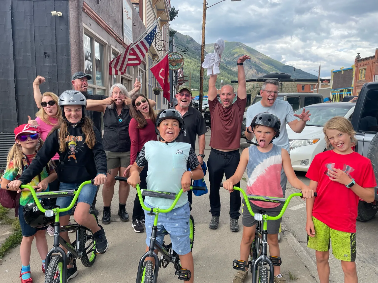 An executive team and local kids laughing together on a Be Legendary retreat in Silverton, Colorado