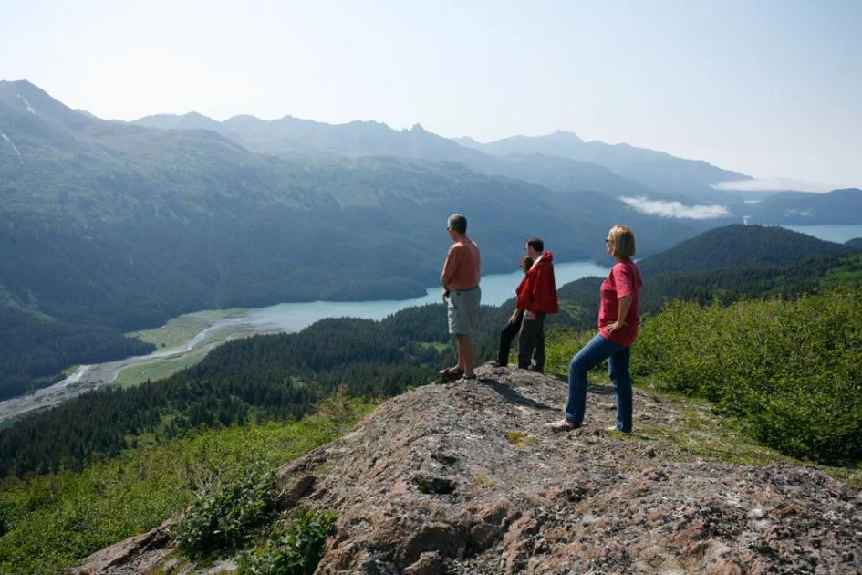 Leadership team taking in a vast remote wilderness landscape