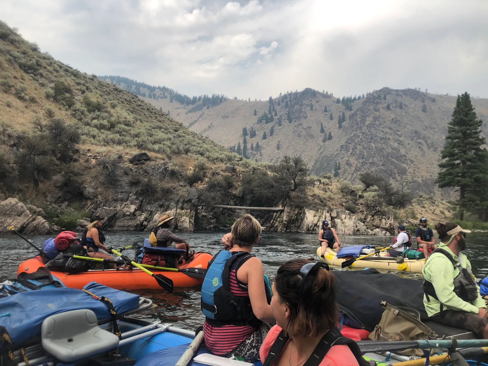 An executive leadership team rafting a river together on a retreat