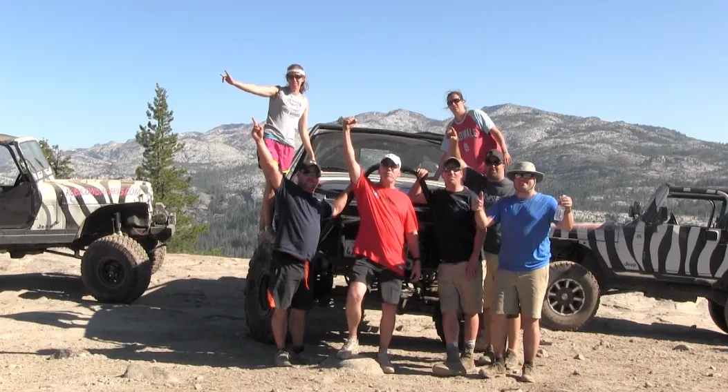 An executive team together at the summit of a leadership retreat